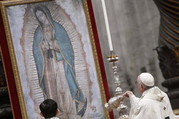 Pope Francis swings a censer in front of an image of Our Lady of Guadalupe as he celebrates Mass on Dec. 12 marking her feast day in St. Peter's Basilica at the Vatican. (CNS photo/Fabio Frustaci, EPA)