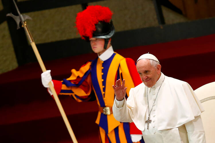 Pope Francis waves as he arrives to lead his general audience in Paul VI hall at the Vatican Dec. 13. (CNS photo/Tony Gentile, Reuters)