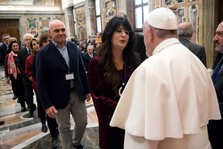 Pope Francis greets members of the Italian Association of Catholic Teachers during a Jan. 5 meeting in Clementine Hall at the Vatican. The group of elementary school teachers recently held its national congress in Rome. (CNS photo/L'Osservatore Romano)