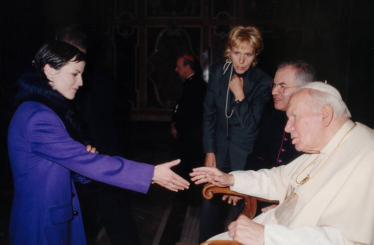 Pope John Paul II greets Dolores O'Riordan, lead singer of Irish pop group The Cranberries, in 2001 at the Vatican. The 46-year-old Catholic lead singer of the Irish band was found dead on Jan. 15 in her London hotel room. (CNS photo/L'Osservatore Romano via Reuters)