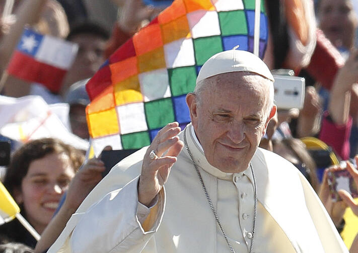 Pope Francis greets the crowd before celebrating Mass at the Maquehue Airport near Temuco, Chile, Jan. 17. (CNS photo/Paul Haring)