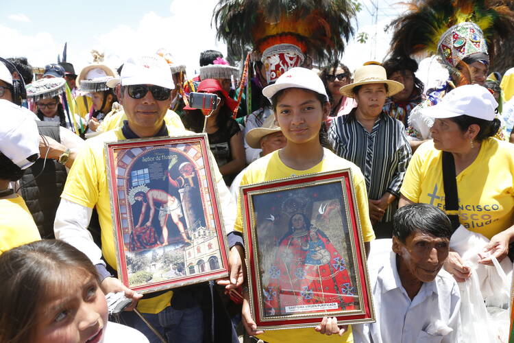 Pilgrims wait for Pope Francis to arrive for a meeting with people at the Jorge Basadre Institute in Puerto Maldonado, Peru, Jan. 19. (CNS photo/Paul Haring)