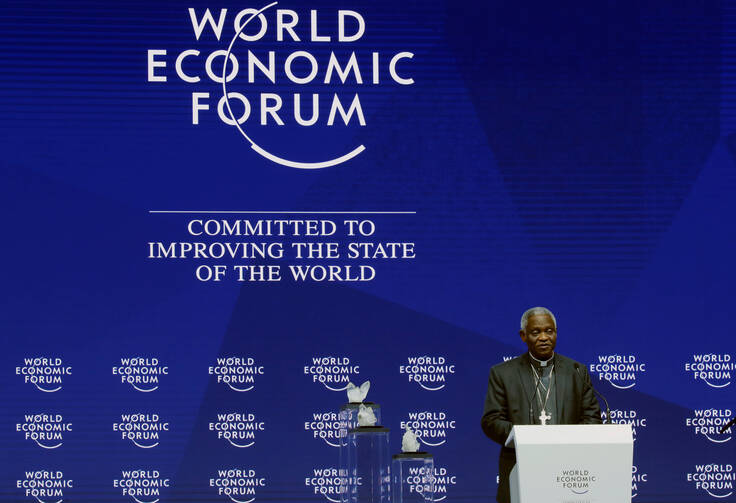 Ghanaian Cardinal Peter Turkson, prefect of the Dicastery for Promoting Integral Human Development, speaks on Jan. 22 during the opening session of the World Economic Forum in Davos, Switzerland. (CNS photo/Denis Balibouse, Reuters)