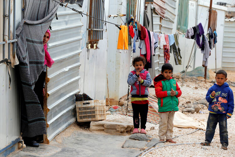 Syrian refugee children play at Zaatari refugee camp Feb. 12 in Jordan. (CNS photo/Muhammad Hamed, Reuters)