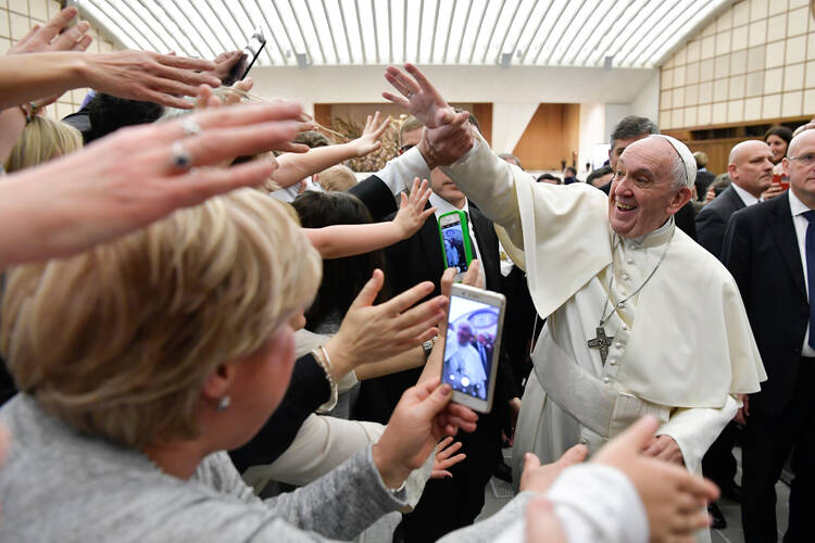 Pope Francis greets people during an audience with Italian nurses in Paul VI hall at the Vatican March 3. (CNS photo/Vatican Media) See POPE-NURSES March 5, 2018.
