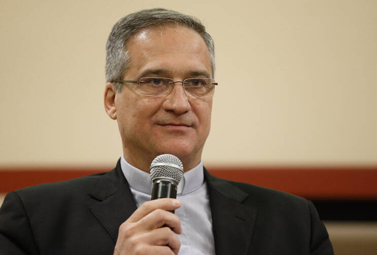 Msgr. Dario Vigano, then-prefect of the Vatican Secretariat for Communication, is pictured at a news conference at the Vatican in this Feb. 8 file photo. (CNS photo/Paul Haring)