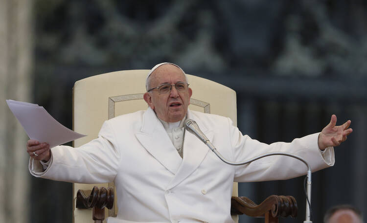 Pope Francis gestures during his general audience in St. Peter's Square at the Vatican April 4. (CNS photo/Paul Haring)