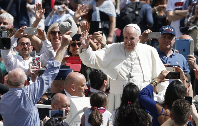  Pope Francis greets the crowd after celebrating Mass marking the feast of Divine Mercy in St. Peter's Square at the Vatican April 8. (CNS photo/Paul Haring)