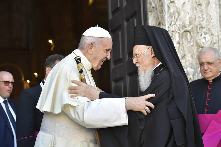 Pope Francis greets Ecumenical Patriarch Bartholomew of Constantinople outside the Basilica of St. Nicholas in Bari, Italy, July 7, 2018. 