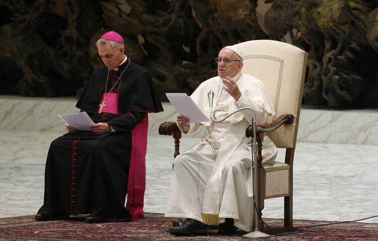 Pope Francis speaks during his general audience in Paul VI hall at the Vatican Aug. 8. Also pictured is Archbishop Georg Ganswein, prefect of the papal household. (CNS photo/Paul Haring) 