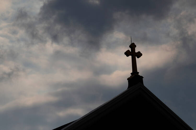 Storm clouds pass over a a Catholic church in Pittsburgh. The Pennsylvania attorney general released a grand jury report Aug. 14 on a months-long investigation into abuse claims spanning a 70-year period in six dioceses, which included Pittsburgh. (CNS photo/Jason Cohn, Reuters)