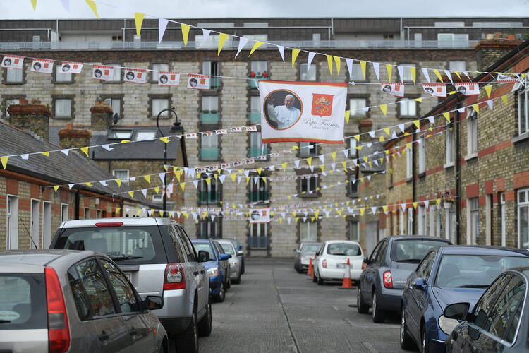 A banner with an image of Pope Francis decorates a street Aug. 13 in Dublin. Pope Francis will visit Dublin and Knock Aug. 25-26, mainly for the World Meeting of Families. (CNS photo/Clodagh Kilcoyne, Reuters)