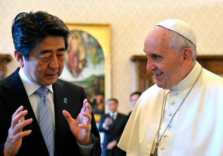 Japanese Prime Minister Shinzo Abe gestures next to Pope Francis during a 2014 private audience at the Vatican. (CNS photo/Alberto Pizzoli, Pool via Reuters)