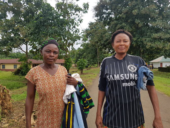 Refugees from Cameroon in the Nigerian village of Agbokim with clothes donated by humanitarian organizations. (Shola Lawal)