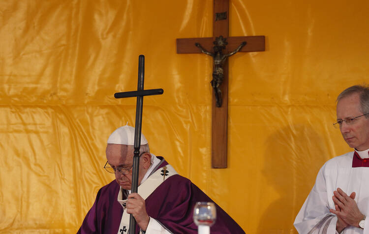 Pope Francis holds his pastoral staff as he celebrates Mass marking the feast of All Souls at Laurentino Cemetery in Rome on Nov. 2, 2018. (CNS photo/Paul Haring) 