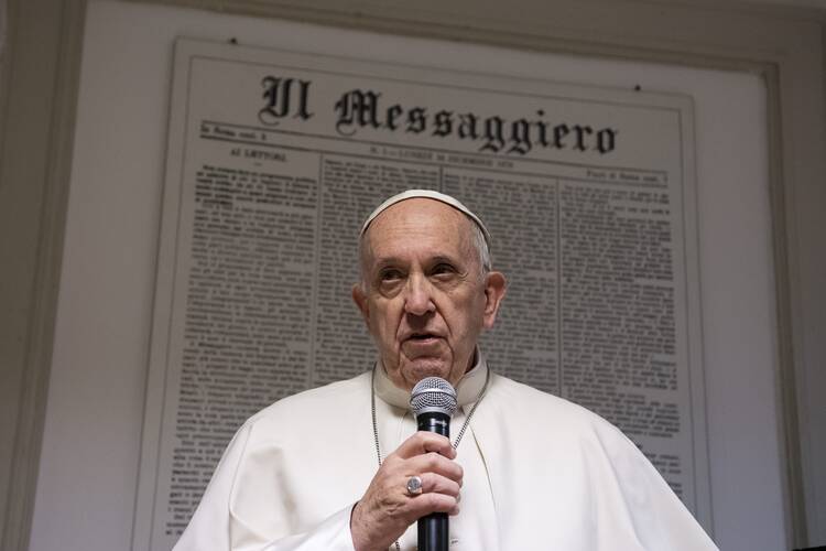 Pope Francis visits Il Messaggero daily newspaper office in Rome Dec. 8.