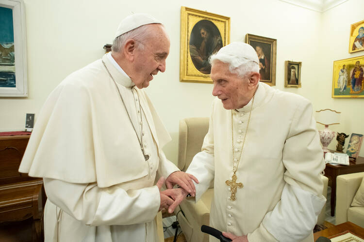 Pope Francis pays a pre-Christmas visit to retired Pope Benedict XVI on Dec. 21, 2018, in the Mater Ecclesiae monastery. (CNS photo/Vatican Media)