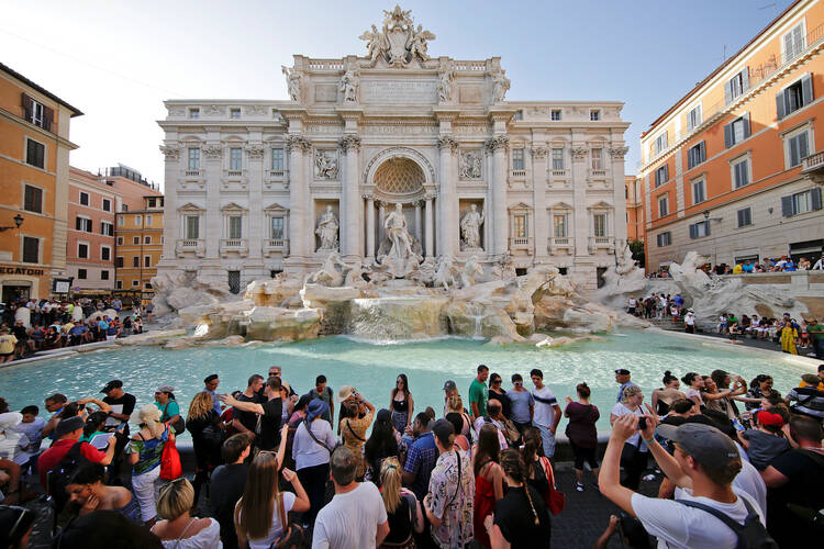 Tourists stand at Rome's Trevi Fountain Aug. 2, 2017. (CNS photo/Max Rossi, Reuters) 