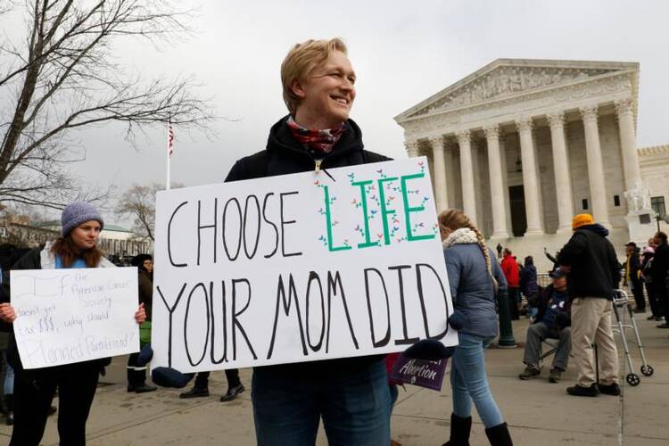 Austin Jennings, a member of the Students for Life at the University of Mary Washington in Fredericksburg, Va., joins pro-life advocates in front of the Supreme Court during the March for Life Jan. 18, 2019. (CNS photo/Gregory A. Shemitz)