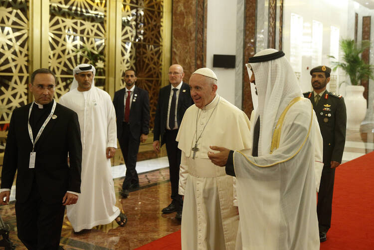 Pope Francis walks with Sheik Mohammed bin Zayed Al Nahyan, crown prince of United Arab Emirates, upon his arrival at Abu Dhabi Presidential Flight airport in United Arab Emirates on Feb. 3. (CNS photo/Paul Haring) 