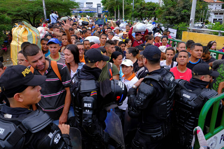 Colombian riot police block the way to the Colombian side in the Colombian-Venezuelan border in Cucuta on April 2. (CNS photo/Ferley Ospina, Reuters) 