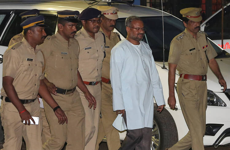 Bishop Franco Mulakkal of Jalandhar, India, is led away for questioning by police on the outskirts of Cochin Sept. 21, 2018. Indian police have charged Bishop Mulakkal of repeatedly raping a nun in her rural convent, the Associated Press reported April 9, 2019. (CNS photo/Sivaram V, Reuters) 