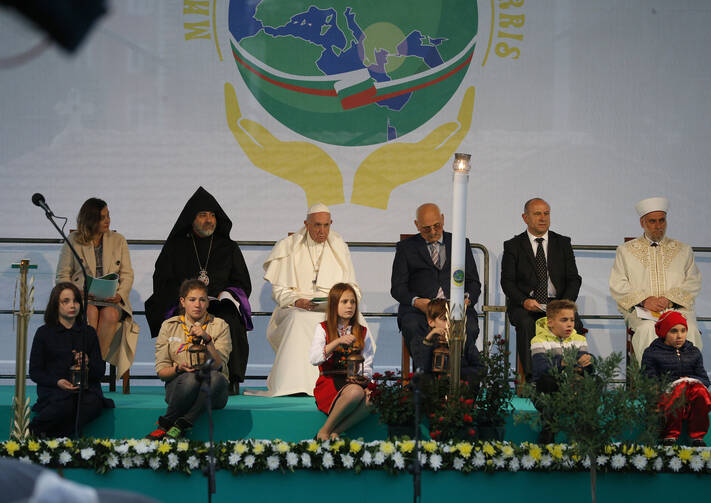Pope Francis sits near young people as he attends a meeting for peace with Bulgarian representatives of various religious in Nezavisimost Square in Sofia, Bulgaria, May 6, 2019. (CNS photo/Paul Haring)