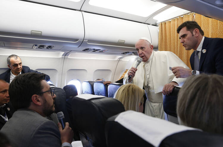 Pope Francis with reporters aboard his flight from Skopje, North Macedonia, to Rome on May 7, 2019. (CNS photo/Paul Haring) 