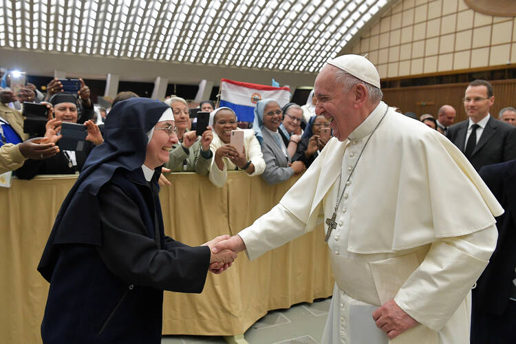 Pope Francis greets a nun during a meeting with 850 superiors general on May 10, 2019, at the Vatican, who were in Rome for the plenary assembly of the International Union of Superiors General. (CNS photo/Vatican Media via Reuters)