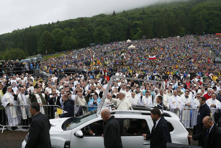 Pope Francis greets the crowd before celebrating Mass at the Marian shrine of Sumuleu Ciuc in Miercurea Ciuc, Romania, June 1, 2019. (CNS photo/Paul Haring)