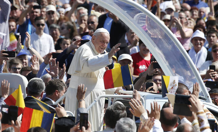Pope Francis greets the crowd before celebrating a Divine Liturgy and the beatification of seven martyred bishops of the Eastern-rite Romanian Catholic Church at Liberty Field in Blaj, Romania, June 2, 2019. (CNS photo/Paul Haring)