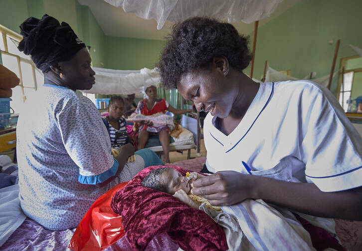Nurse Annet Kojo feeds a 4-day-old baby girl in the maternity ward of the St. Daniel Comboni Catholic Hospital in Wau, South Sudan, on April 16, 2018. (CNS photo/Paul Jeffrey) 
