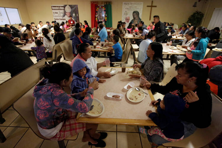 Migrants eat at a Catholic-run shelter in Ciudad Juarez, Mexico, May 10, 2019. (CNS photo/Jose Luis Gonzalez, Reuters) 