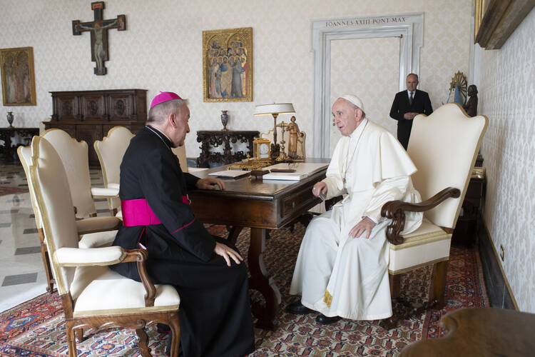 Archbishop Luigi Ventura, the Vatican nuncio to France, meets with Pope Francis at the Vatican in this file photo from Oct. 18, 2018.