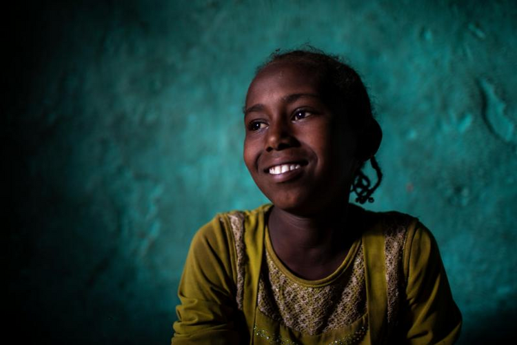 Image: Semria Abdujelile, 9, sits at her family's home in a rural area of Ethiopia's Oromia region Feb. 9, 2019. The church in Ethiopia is leading peace and reconciliation efforts and also working to help the millions of people who have fled their homes after an upsurge in communal violence. (CNS photo/Will Baxter, courtesy CRS)