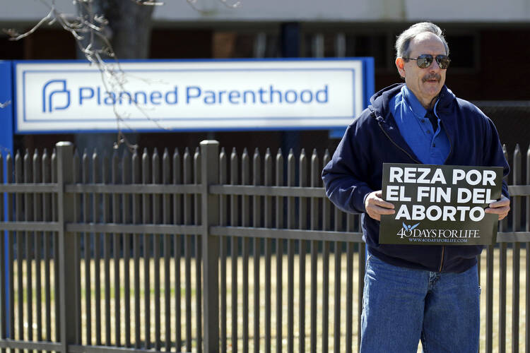 Pro-life advocate Joe San Pietro participates in a 40 Days for Life vigil near the entrance to a Planned Parenthood center in Smithtown, N.Y., on March 26, 2019. (CNS photo/Gregory A. Shemitz) 
