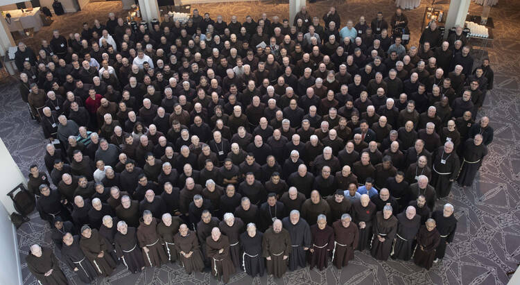 Nearly 400 Franciscans pose Aug. 1, 2019, during a four-day gathering in Denver. It is one of the largest gatherings of Franciscans in the United States, with the purpose of friars getting to know each other as the process of the order's six provinces become one. The gathering took place July 29-Aug. 2. (CNS photo/Octavio Duran)