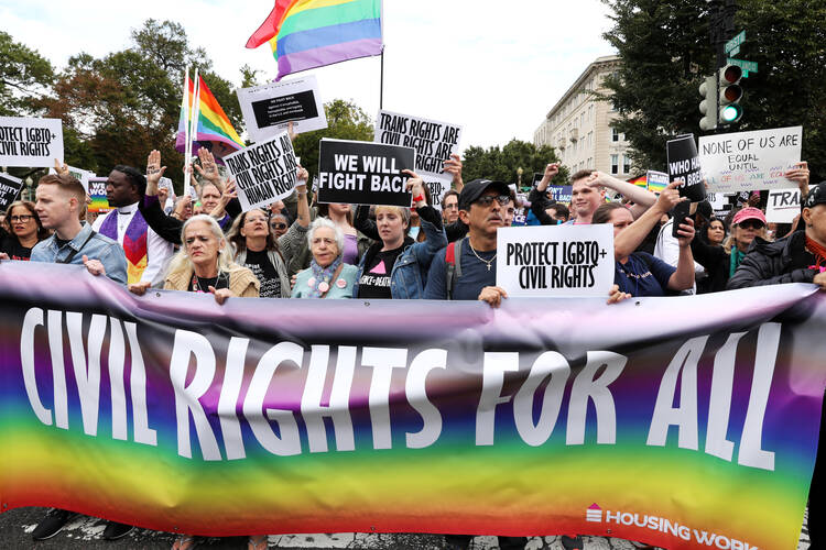 Activists and supporters block the street outside the U.S. Supreme Court in Washington on Oct. 8, 2019, as it hears arguments in three major employment discrimination cases on whether federal civil rights law prohibiting workplace discrimination on the "basis of sex" covers gay and transgender employees. (CNS photo/Jonathan Ernst, Reuters)