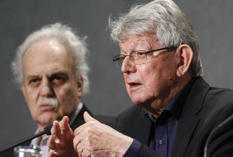 Retired Bishop Erwin Krautler of Xingu, Brazil, speak at a press briefing following a session of the Synod of Bishops for the Amazon at the Vatican Oct. 9, 2019. Also pictured is scientist Carlos Alfonso Nobre, winner of the Nobel Peace Prize in 2007. (CNS photo/Paul Haring) 