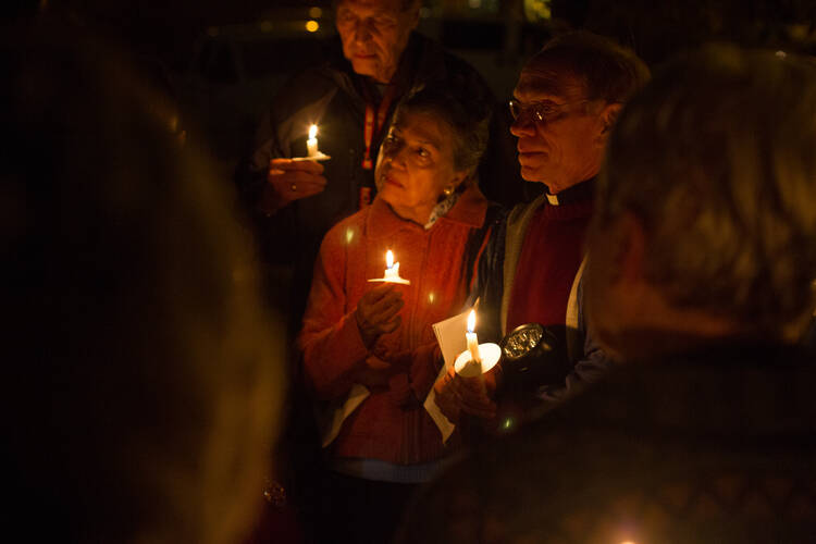 A candlelit vigil against the death penalty, held outside the Texas State Penitentiary at Huntsville on Dec. 16, 2016. (CNS photo/James Ramos, Texas Catholic Herald)