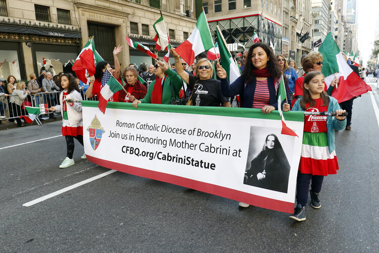 Supporters of a public statue for St. Frances Xavier Cabrini in New York City march behind a Diocese of Brooklyn, N.Y., banner during the Columbus Day Parade in New York City on Oct. 14, 2019. (CNS photo/Gregory A. Shemitz)
