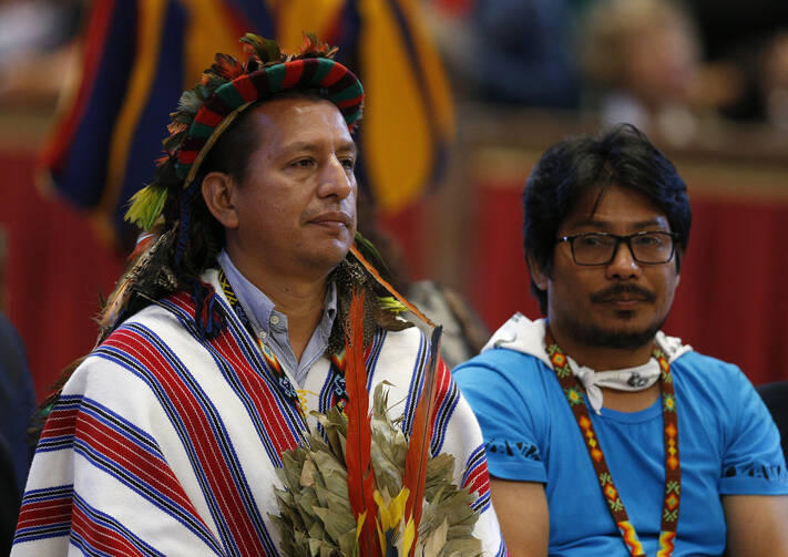 People attend the concluding Mass of the Synod of Bishops for the Amazon celebrated by Pope Francis at the Vatican Oct. 27, 2019. (CNS photo/Paul Haring)