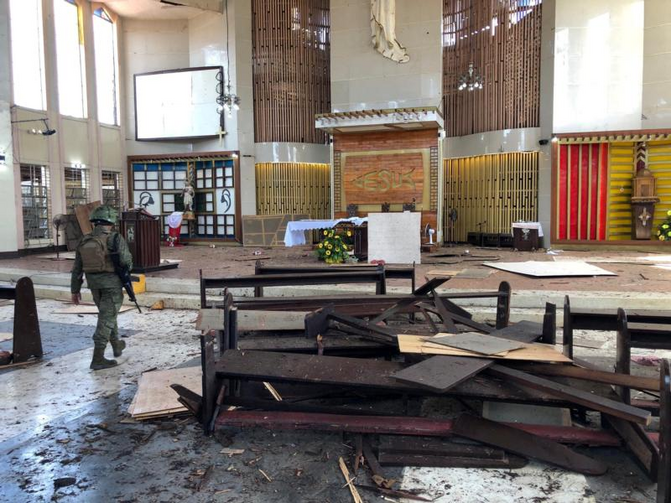 Image: A Philippine army member inspects damage inside the Cathedral of Our Lady of Mount Carmel following a bomb blast in Jolo Jan. 27, 2019. (CNS photo/Armed Forces of the Philippines via Reuters)
