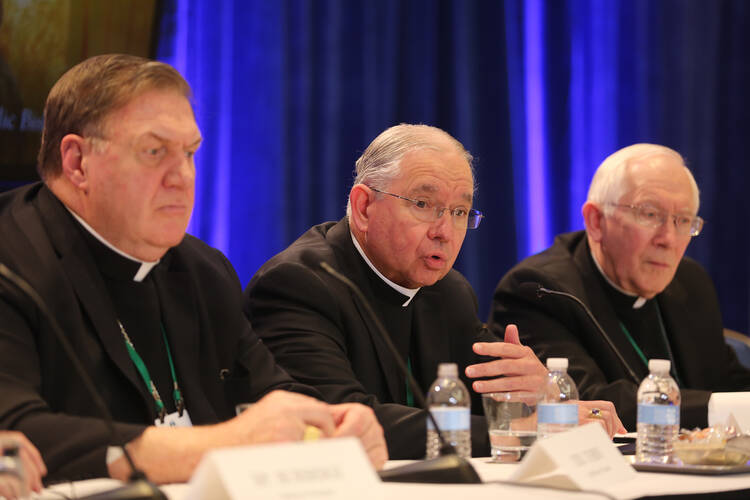 Archbishop Jose H. Gomez of Los Angeles, president-elect of the U.S. Conference of Catholic Bishops, responds to a question during a news conference at the fall general assembly of the USCCB in Baltimore Nov. 12, 2019. Also pictured are: Cardinal Joseph W. Tobin of Newark, N.J., and Archbishop Leonard P. Blair of Hartford, Conn. (CNS photo/Bob Roller) 