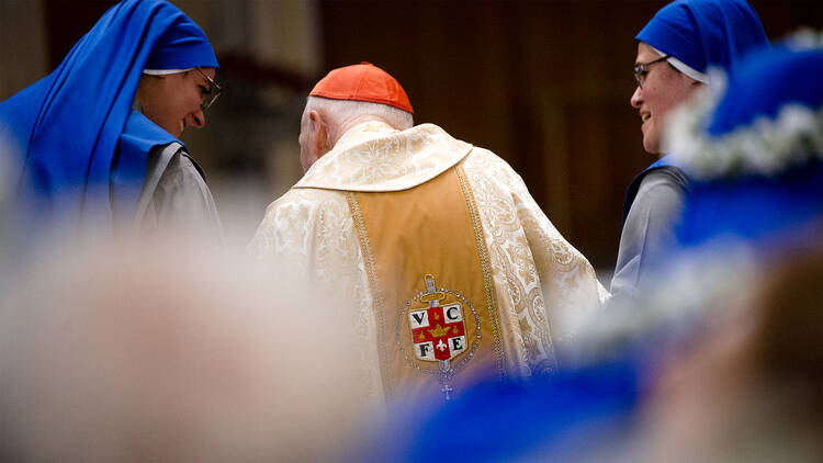 In this 2017 file photo, former Cardinal Theodore E. McCarrick is seen with Servants of the Lord and the Virgin of Matara at Holy Comforter-St. Cyprian Catholic Church in Washington. (CNS photo/Tyler Orsburn)