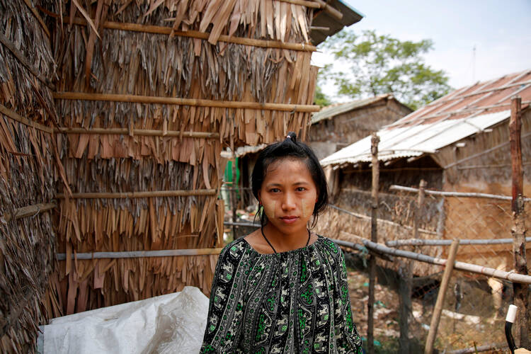 A young woman is pictured in a file photo near her hostel in Yangon, Myanmar. (CNS photo/Myat Thu Kyaw, Reuters)