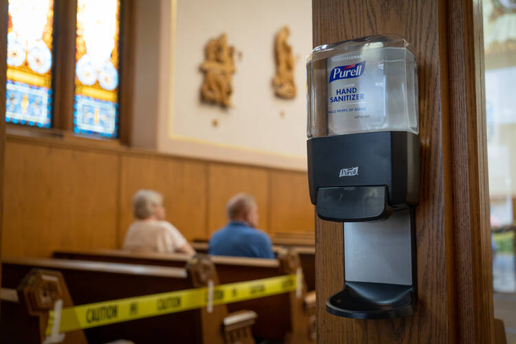The Paycheck Protection Program has helped parishes to keep church doors open during the pandemic, a time of increasing need for spiritual support. (CNS photo/Katie Rutter) 
