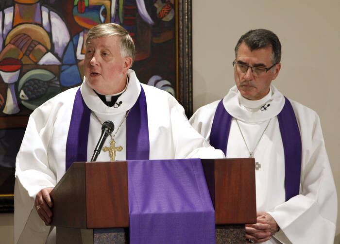 Bishop Mitchell T. Rozanski of Springfield, Mass., addresses the congregation alongside Lutheran Bishop Donald Kreiss, chair of the Evangelical Lutheran Church in America's ecumenical and interreligious relations committee, during a March 2, 2017, prayer service in Chicago. (CNS photo/Karen Callaway, Chicago Catholic) 