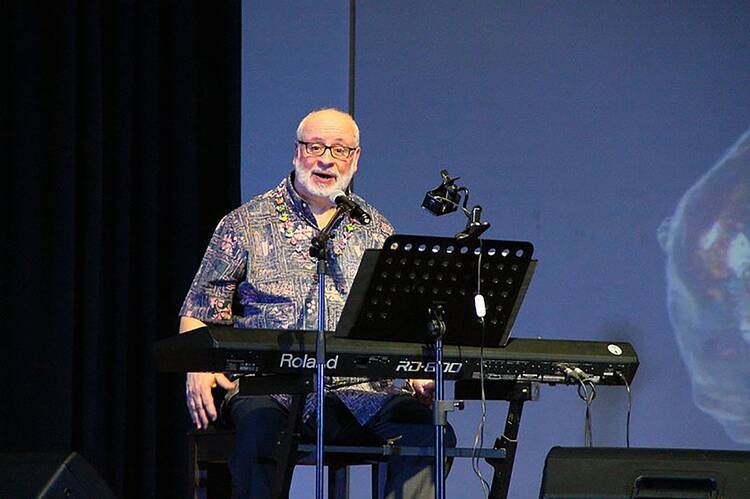 Catholic composer David Haas is shown in a concert at the Ateneo de Manila University in Quezon City, Philippines, in this 2016 photo. (CNS photo/Titopao, CC BY-SA 4.0)