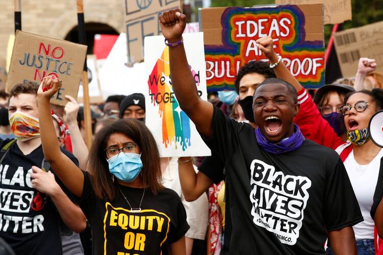 Demonstrators in Denver advocate for Black, indigenous and Latino communities July 4, 2020. (CNS photo/Kevin Mohatt, Reuters)